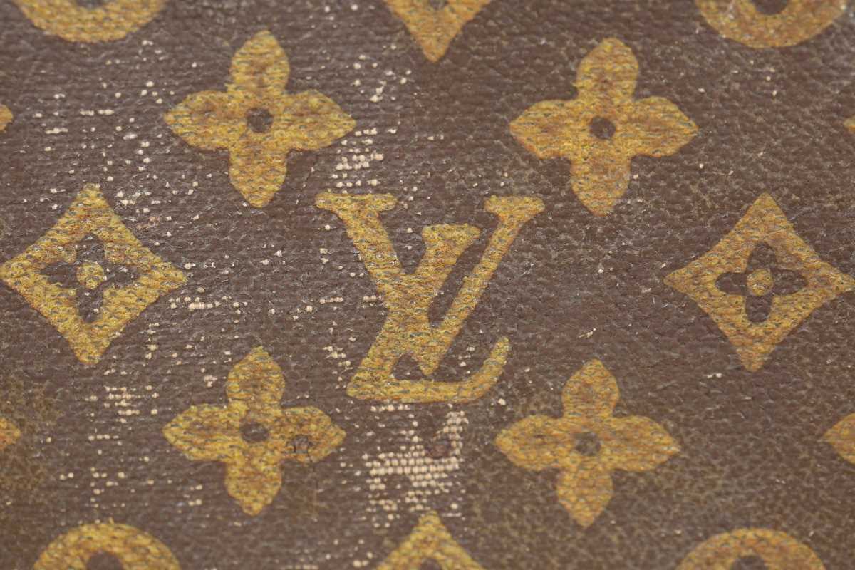 An early 20th century Louis Vuitton travelling trunk with overall monogram canvas covering and tan - Image 7 of 42