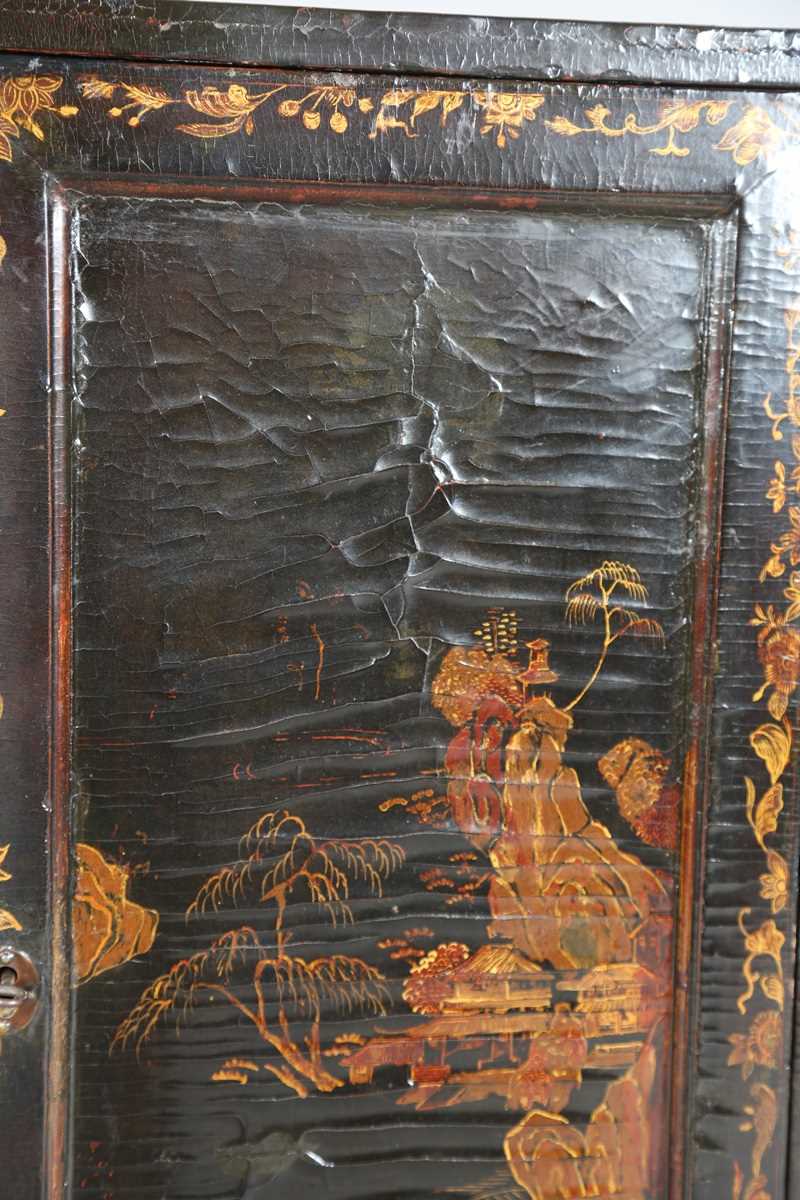 An 18th century Chinese black lacquered collector's cabinet, decorated in gilt with landscape - Image 17 of 28