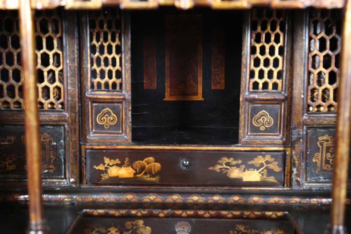 An 18th century Chinese black lacquered collector's cabinet, decorated in gilt with landscape - Image 10 of 28