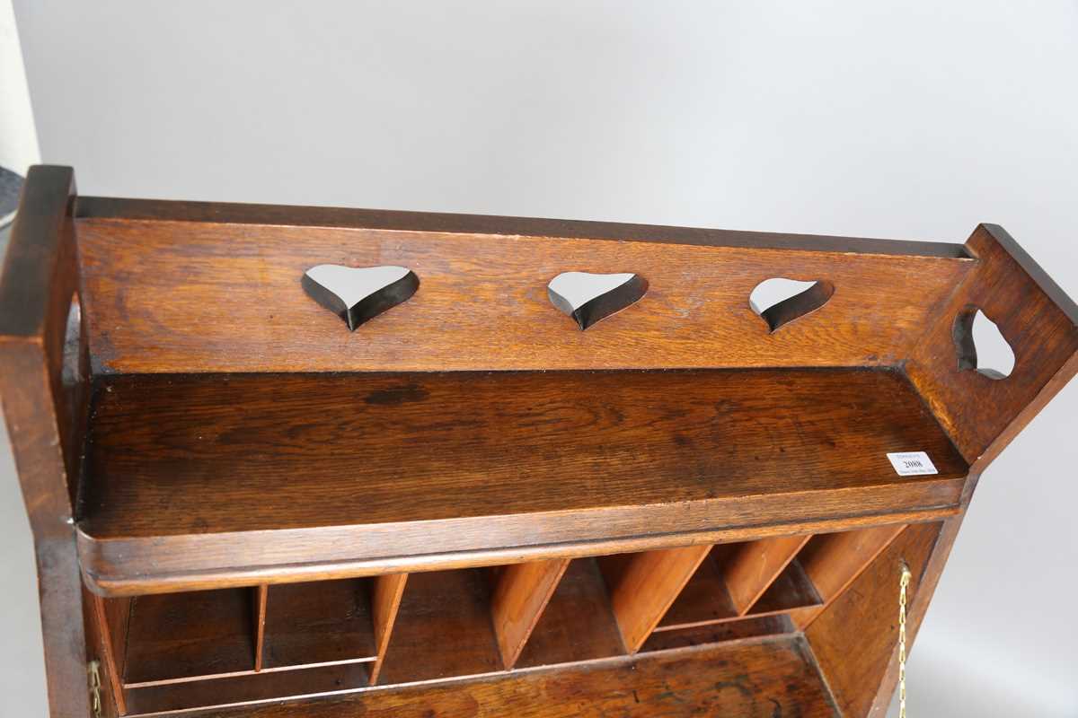 An early 20th century Arts and Crafts oak student's bureau, in the manner of Liberty & Co, height - Image 5 of 11