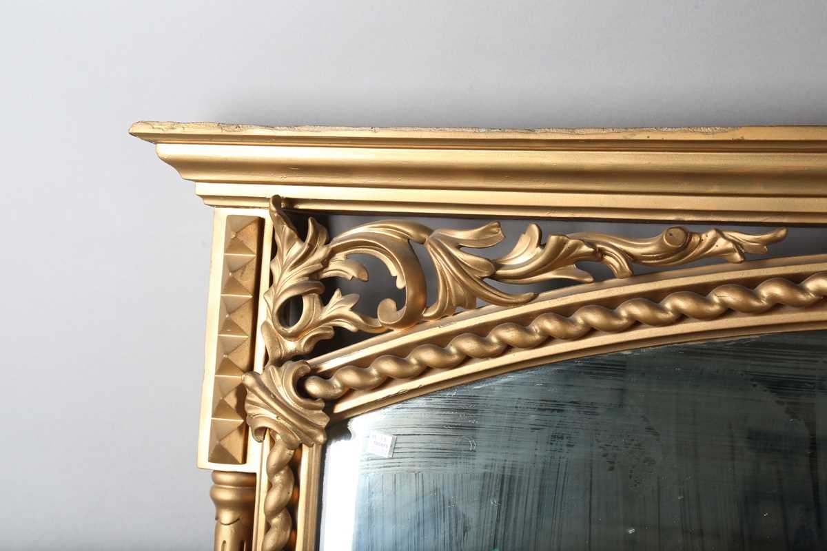 A late Victorian gilt painted overmantel mirror with pierced foliate corner panels and spiral turned - Image 3 of 9