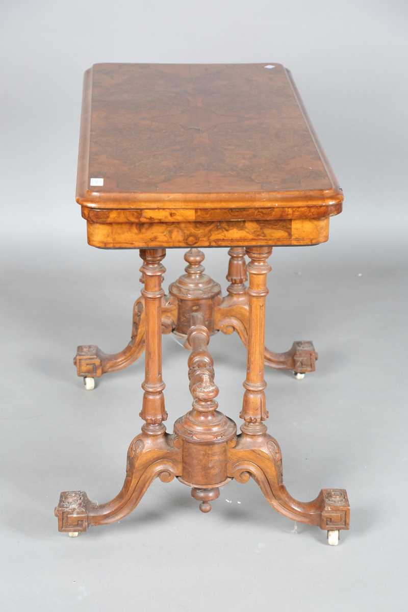A mid-Victorian burr walnut rectangular fold-over card table, raised on fluted legs and carved feet, - Image 14 of 14