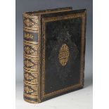 A late Victorian gilt-tooled leather family bible with interior monochrome plates, height 32cm.