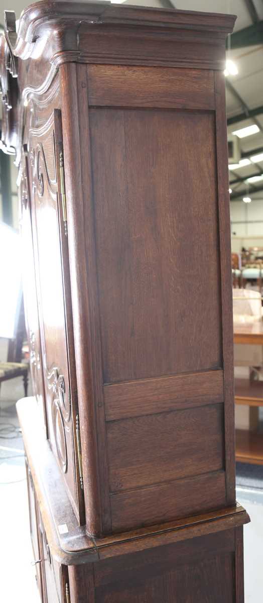 A 19th century French oak side cabinet with an arched pediment and four carved panel doors, height - Image 13 of 14