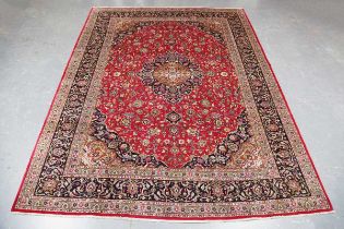 A Mashad carpet, Central Persia, late 20th century, the claret field with a central medallion