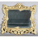 A 20th century Florentine style gilt painted and carved wooden rectangular wall mirror, 74cm x