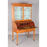 An Edwardian Neoclassical Revival satinwood cylinder bureau bookcase with overall kingwood