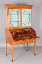 An Edwardian Neoclassical Revival satinwood cylinder bureau bookcase with overall kingwood