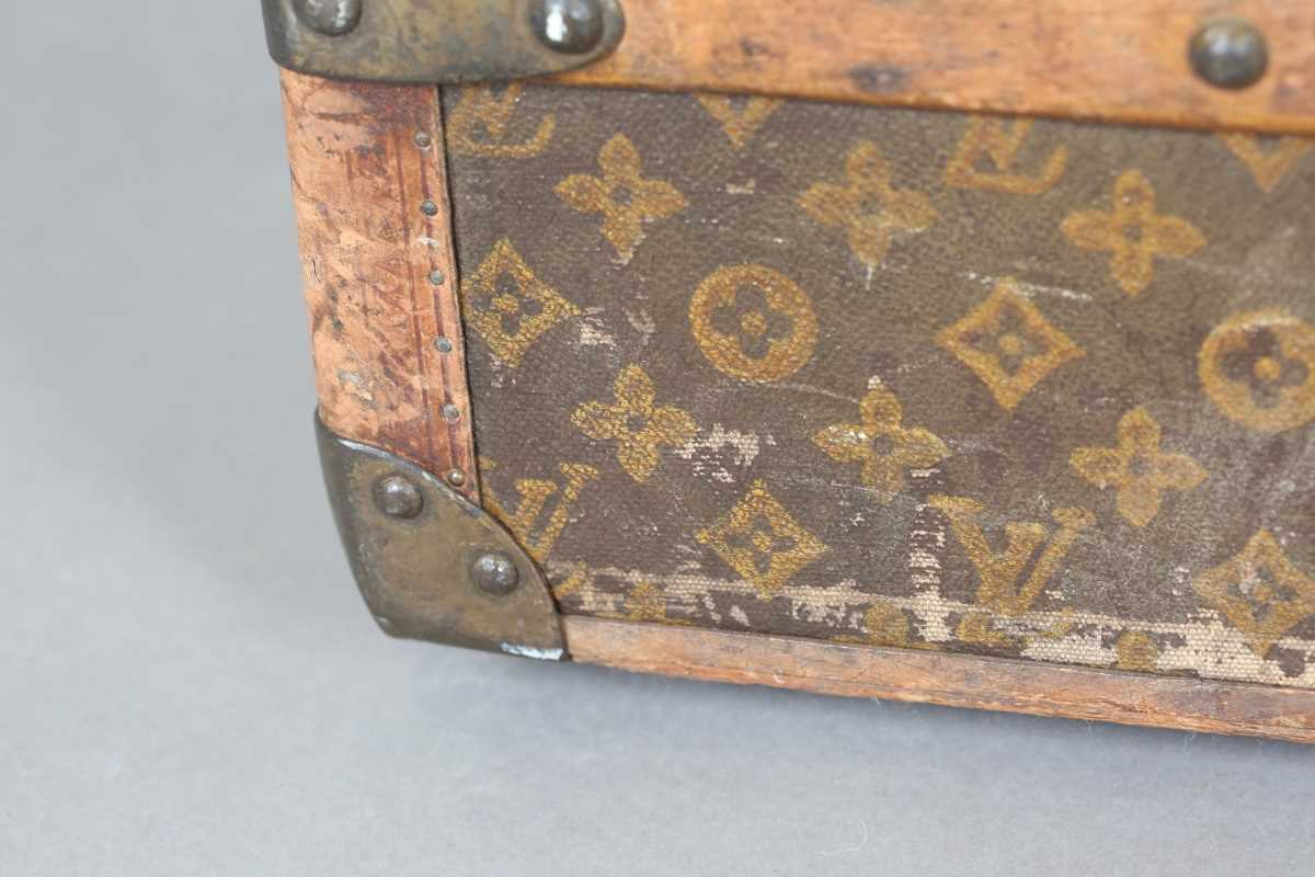 An early 20th century Louis Vuitton travelling trunk with overall monogram canvas covering and tan - Image 30 of 42