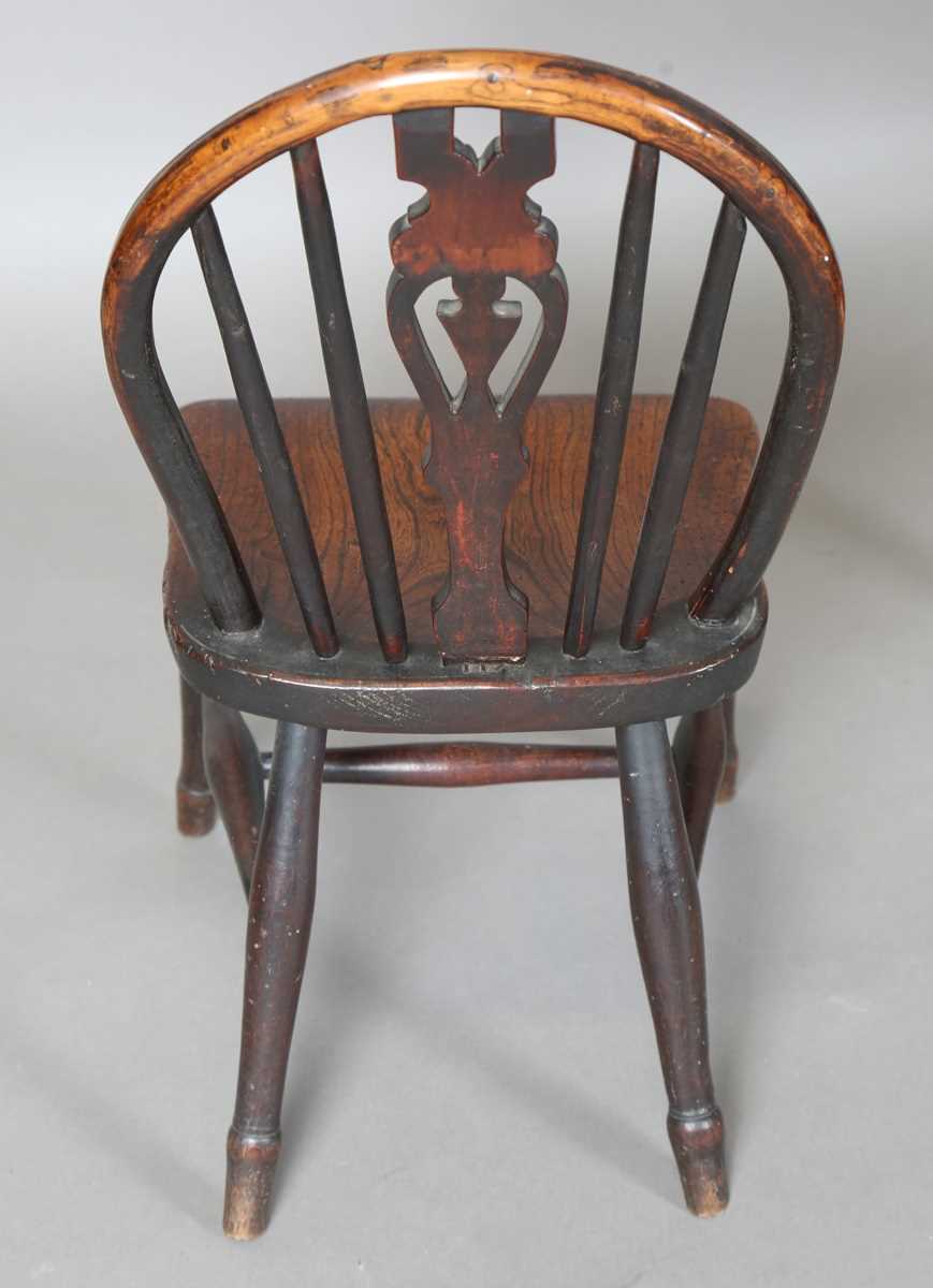 A 19th century child’s beech and elm Windsor chair, on turned legs united by stretchers, height - Image 5 of 17