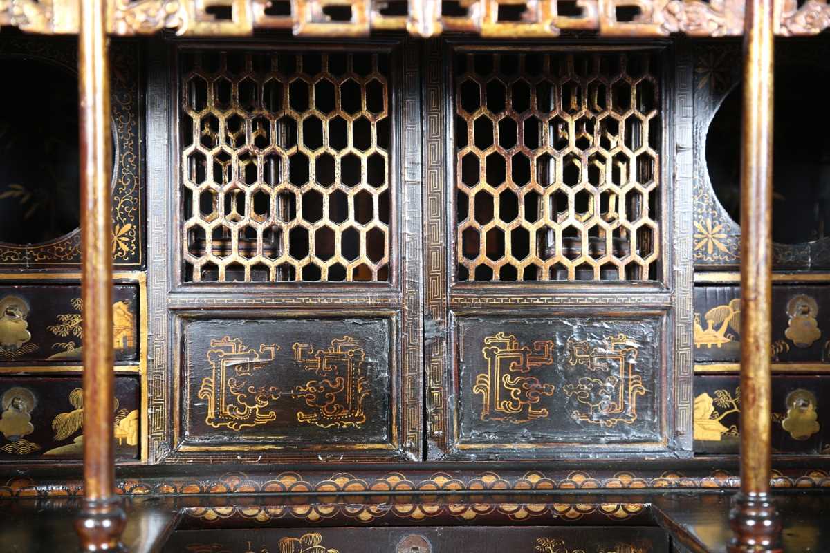 An 18th century Chinese black lacquered collector's cabinet, decorated in gilt with landscape - Image 2 of 28