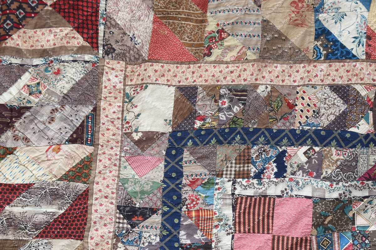 A large mid-19th century cotton 'medallion' patchwork quilt, finely worked with overall printed - Image 5 of 10
