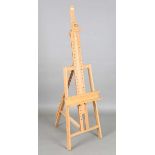 A modern beech artist's easel, height 180cm. Provenance: collection of notable Arundel based