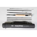 A group of seven fishing rods, including a Shakespeare Expedition 9' 6" seven-piece fly fishing rod,