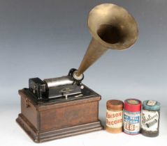 An early 20th century Edison Fireside phonograph, within an oak case, together with model-C