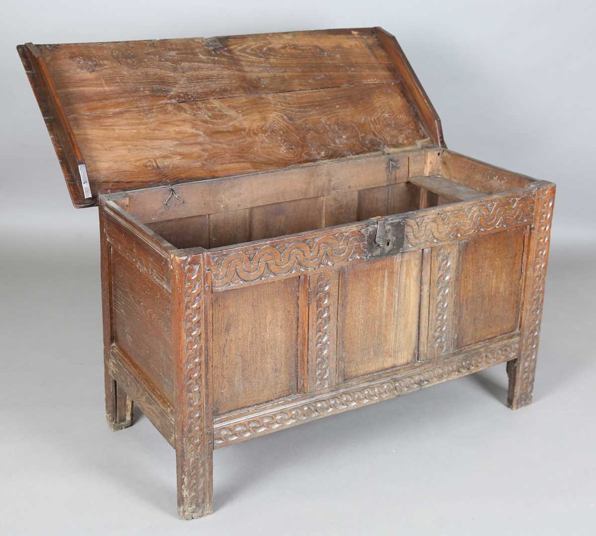 A 17th century oak panelled coffer, the lid with original wire hinges, height 71cm, width 125cm, - Image 5 of 17