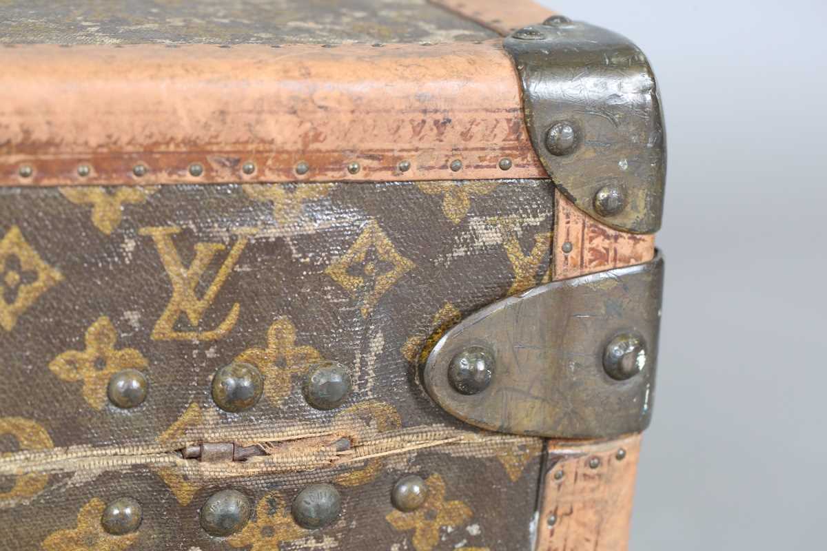An early 20th century Louis Vuitton travelling trunk with overall monogram canvas covering and tan - Image 32 of 42