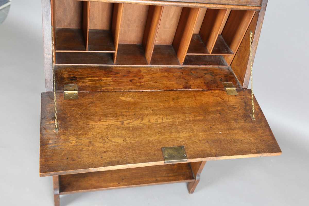 An early 20th century Arts and Crafts oak student's bureau, in the manner of Liberty & Co, height - Image 3 of 11