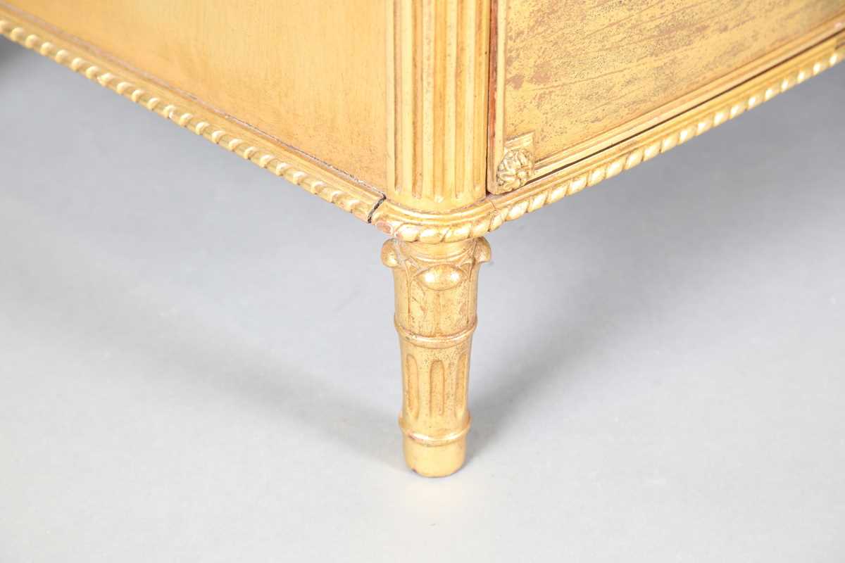 An early 20th century French gilt painted bowfront five-drawer commode, inset with a later top, - Image 6 of 9