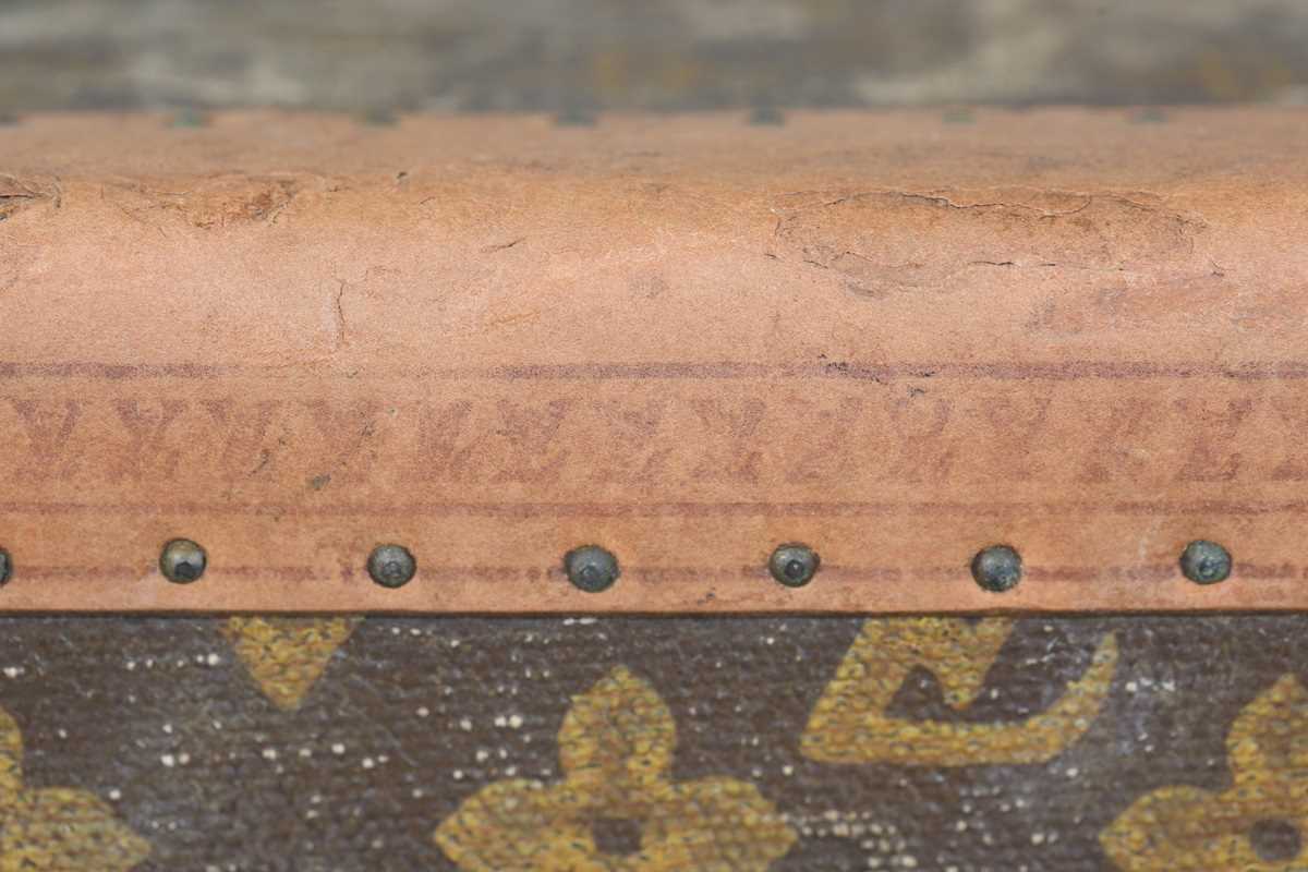 An early 20th century Louis Vuitton travelling trunk with overall monogram canvas covering and tan - Image 12 of 42
