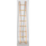 An early/mid-20th century pine and ash eight-rung ladder, height 183cm, width 29cm.