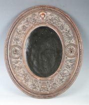 A 19th century Italian carved wooden oval wall mirror, the finely worked frame detailed 'Sienna