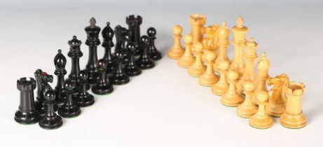 An early 20th century boxwood and ebony Staunton chess set with weighted bases, the knights and
