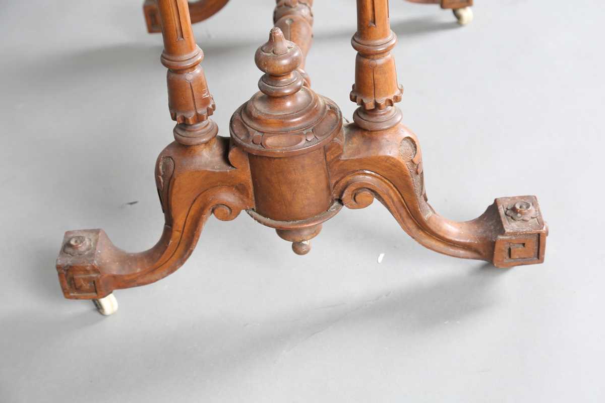 A mid-Victorian burr walnut rectangular fold-over card table, raised on fluted legs and carved feet, - Image 10 of 14