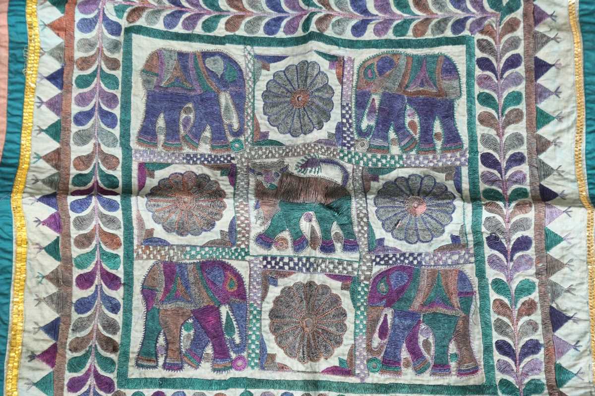 An Indian kutch mirrorwork panel, the central figural panel within a compartmentalized surround, - Image 13 of 16