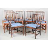 A set of eight George III Sheraton period mahogany framed dining chairs, comprising two carvers,