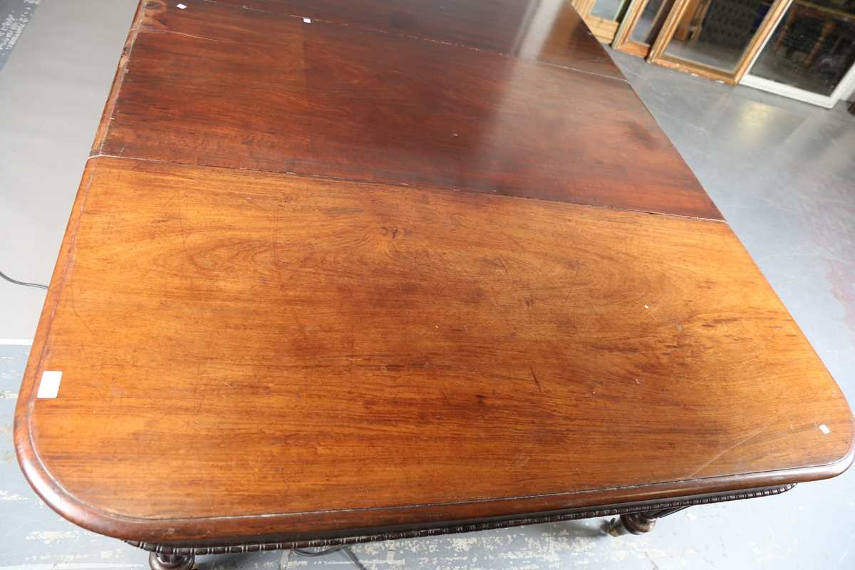 A William IV mahogany pull-out extending dining table, in the manner of Gillows of Lancaster, the - Image 3 of 13