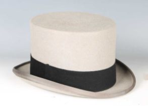 A grey felt top hat by Lock & Co, St James's Street, London, head circumference 58.5cm, boxed.