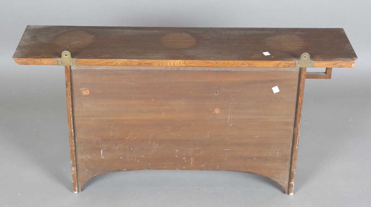 An Edwardian Arts and Crafts oak wall cabinet, in the manner of Liberty & Co, with coppered hinge - Image 10 of 13