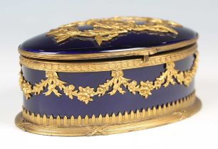 An early 20th century French Neoclassical Revival gilt metal mounted blue glazed porcelain oval