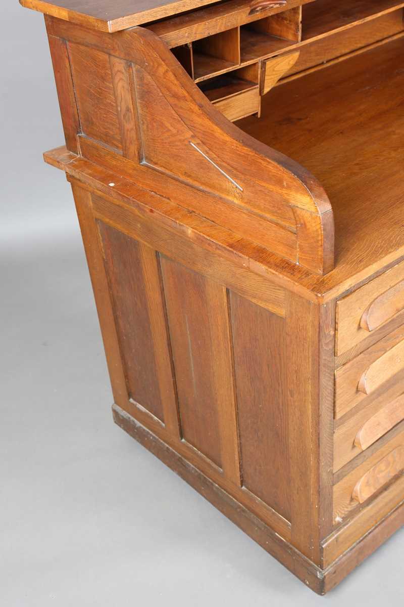 An Art Deco oak roll-top desk, fitted with an arrangement of drawers, height 114cm, width 150cm, - Image 8 of 12