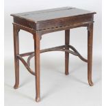 A late 20th century hardwood writing table, the hinged lid enclosing a writing surface, height 80cm,