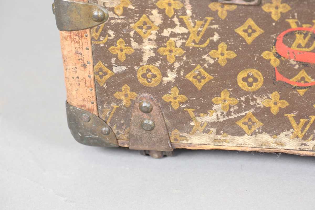 An early 20th century Louis Vuitton travelling trunk with overall monogram canvas covering and tan - Image 23 of 42
