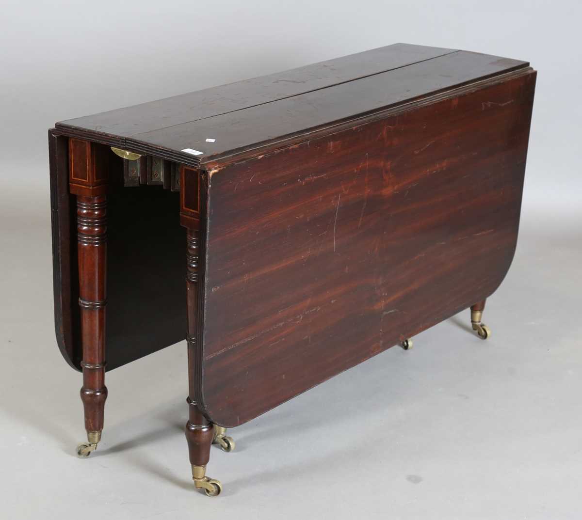A Regency mahogany concertina-action extending dining table, in the manner of Wilkinson of - Image 15 of 16
