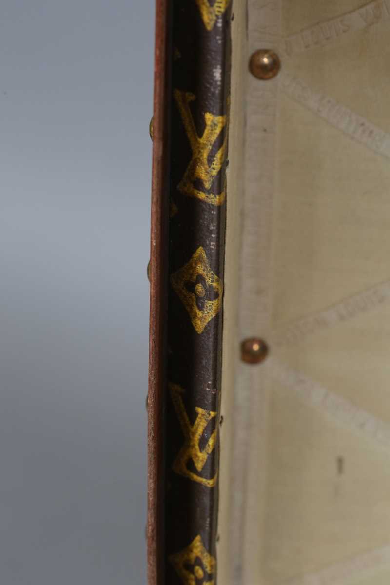 An early 20th century Louis Vuitton travelling trunk with overall monogram canvas covering and tan - Image 19 of 42