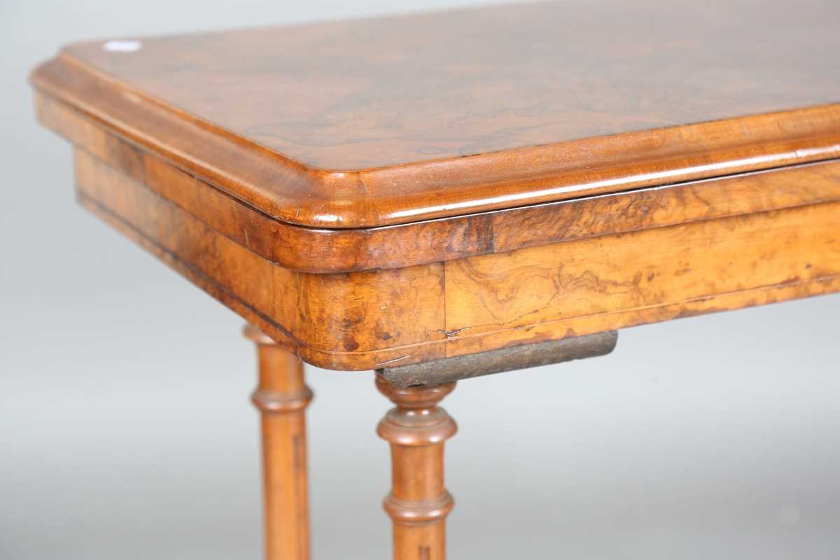 A mid-Victorian burr walnut rectangular fold-over card table, raised on fluted legs and carved feet, - Image 8 of 14