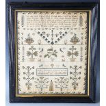 A William IV needlework sampler by Mary George, 'in the 12th year of her age', dated 1835, finely