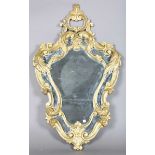 An early 20th century Rococo style gilt painted wooden framed sectional wall mirror of cartouche