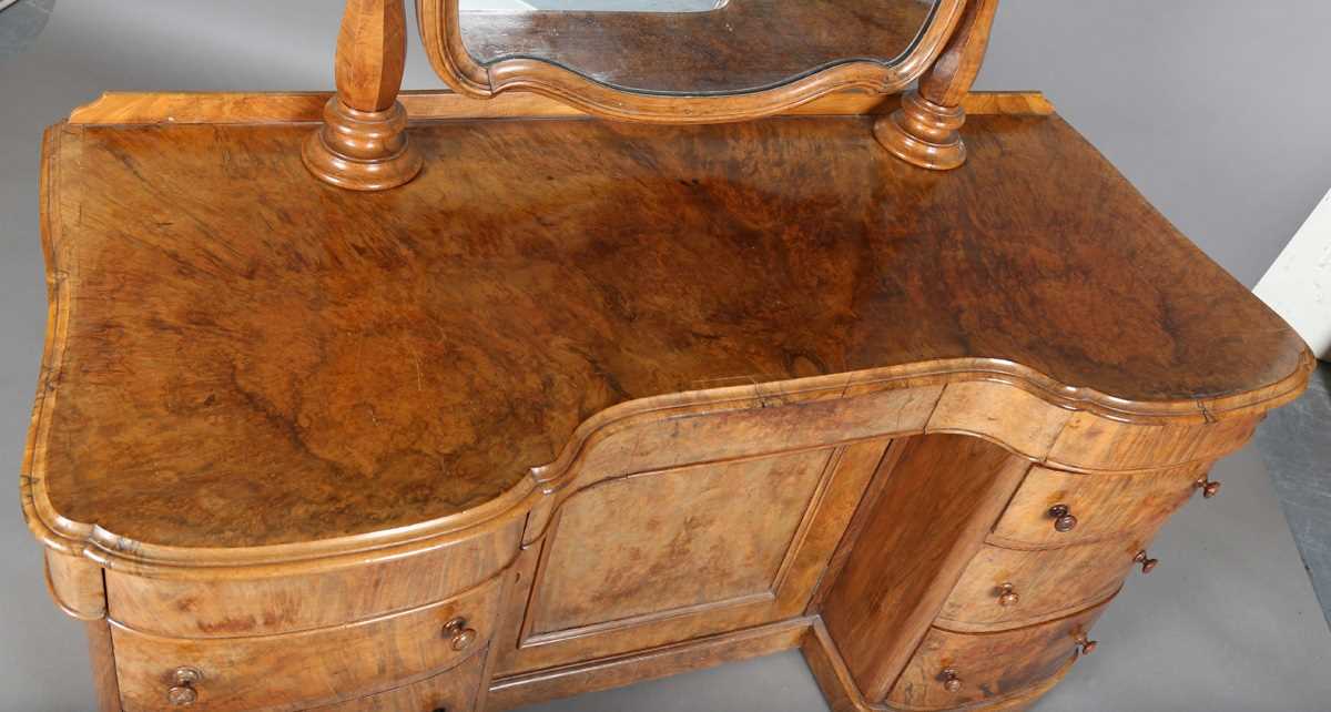 A mid-Victorian burr walnut kneehole dressing table, fitted with a swing mirror above an arrangement - Image 2 of 13