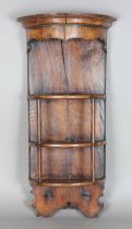 A 20th century early Georgian style walnut and oak demi-lune open wall shelf, height 110cm, width
