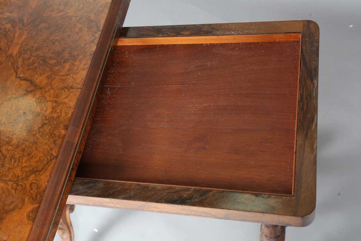 A mid-Victorian burr walnut rectangular fold-over card table, raised on fluted legs and carved feet, - Image 6 of 14