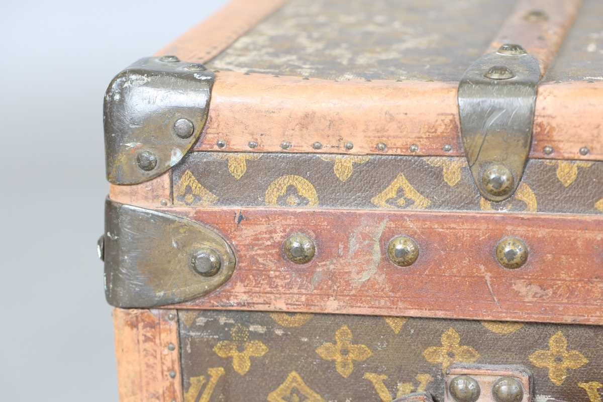 An early 20th century Louis Vuitton travelling trunk with overall monogram canvas covering and tan - Image 24 of 42