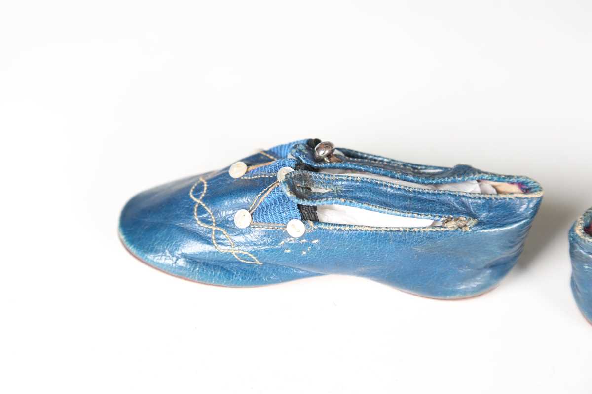 A pair of 19th century blue leather infant's shoes with applied mother-of-pearl buttons and polished - Image 4 of 8