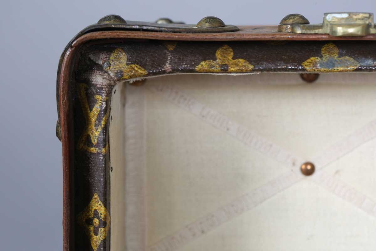 An early 20th century Louis Vuitton travelling trunk with overall monogram canvas covering and tan - Image 18 of 42