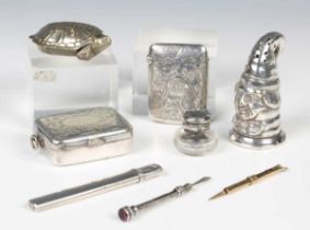 A small group of silver and plated objects of virtu, including a plated pepperette in the form of