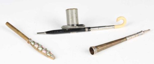 An early 20th century novelty dip pen in the form of an umbrella and top hat, length 11.5cm,